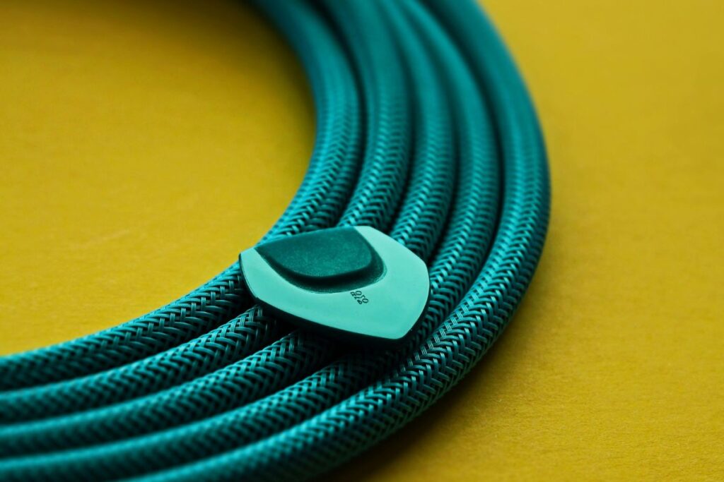 tidy cables wrapped in fabric sleeve behind desk