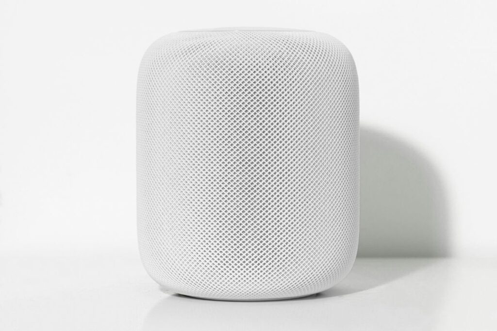 apple homepod mini on minimal desk surface