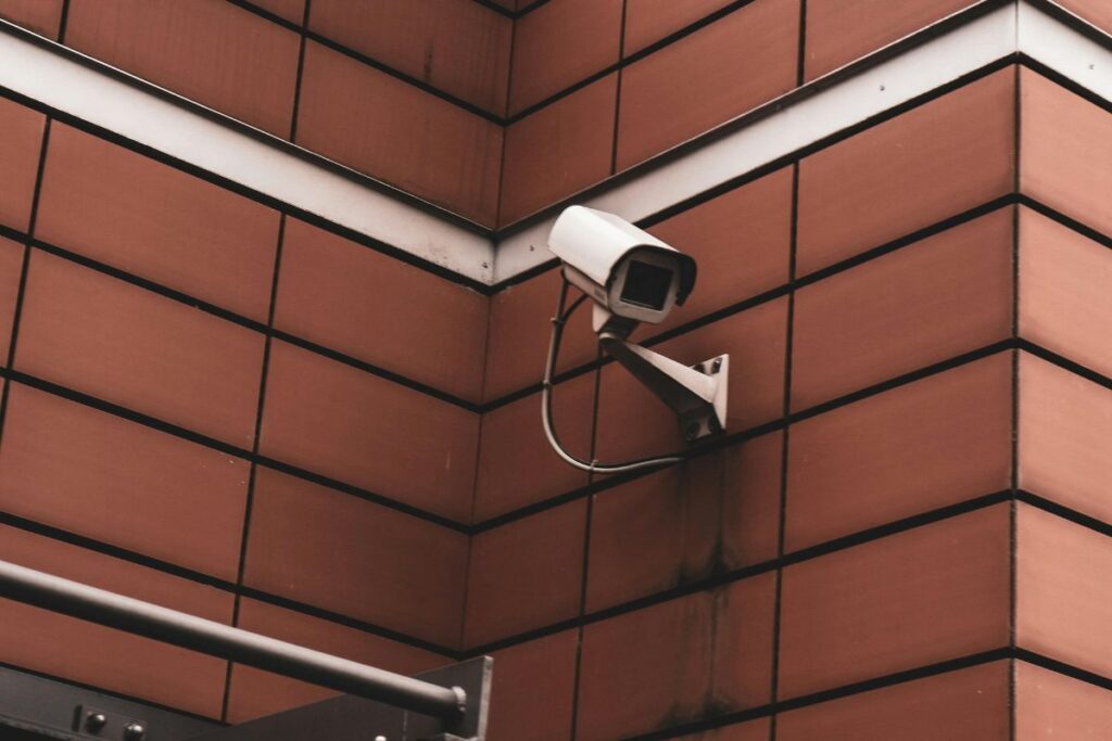 clean home exterior with visible security camera