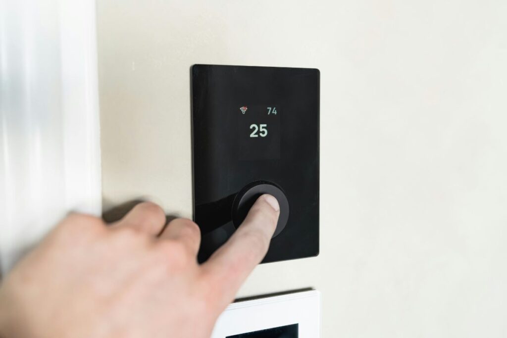 smart thermostat mounted on clean minimal wall
