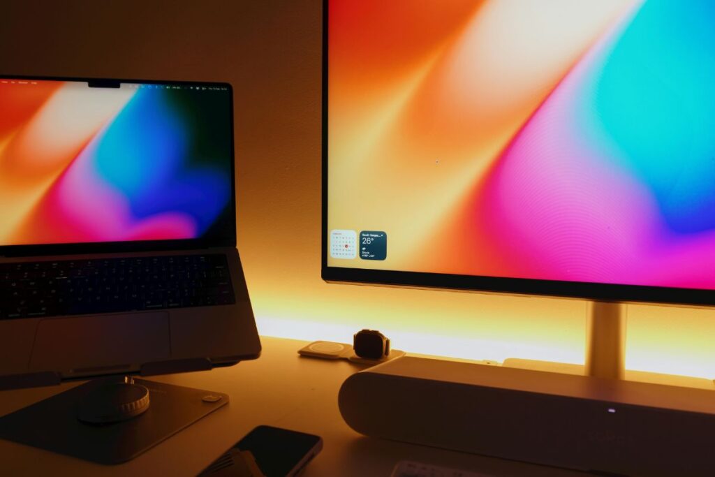 monitor light bar illuminating clean home office desk