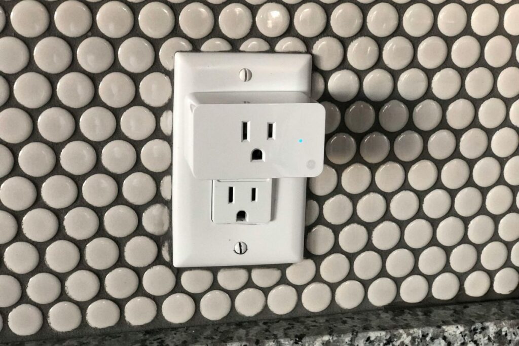 smart plug inserted in wall socket minimal home