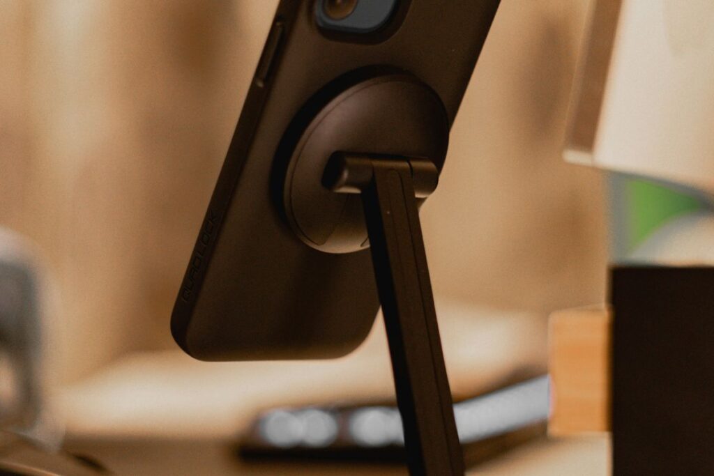 magnetic phone mount holding phone at desk edge