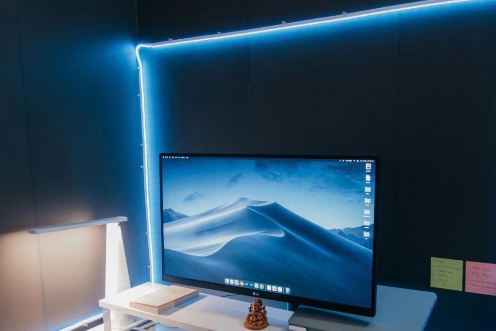 led bias lighting strip behind monitor on desk